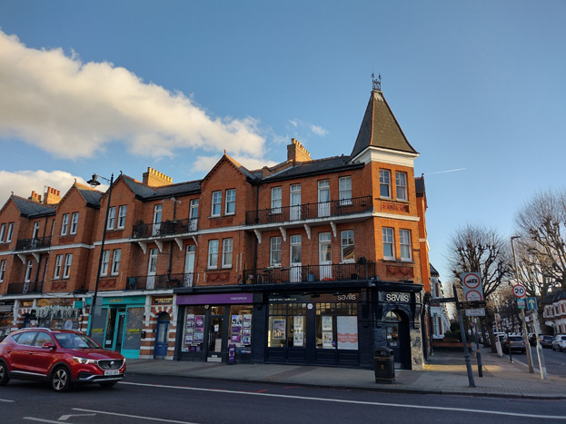 Fig. 26: Attractive shopfronts within the ground floor of a mansion block