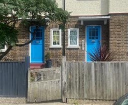 Fig. 78 (a): These two images show original doors. The attractive and varied glazing patterns and the consistency of the doors give the terrace houses a rhythm and cohesive character.