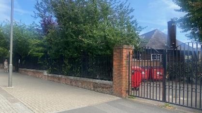 Fig. 96: The boundary to Beatrix Potter school. Photograph can be compared to the old photograph on the chapter page. The grounds have matured and form a verdant part of Magdalen Road.