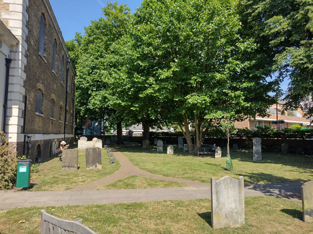 Fig: 85. The churchyard is one of the few greenspaces and its mature planting and benches attract residents to spend time in the grounds