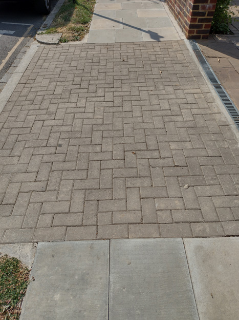 Fig. 78: The new paving is lighter in colour and rationalises the layout, with bricks to drives and pavers between them